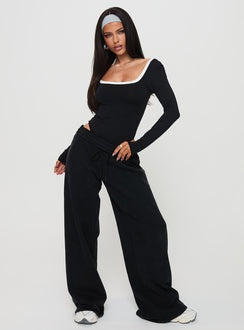 side view of model wearing Princess Polly Ender Contrast Trim Bodysuit Black Long Sleeve Tops Bodysuit 