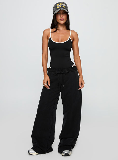 side view of model wearing Princess Polly That Effect Bodysuit Black Sleeveless Bodysuit 