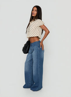 Crafted with the Roamer No Waist Low Rise Super Baggy Vintage Mid Blue womens jeans showcasing low-rise waist side view of model wearing Princess Polly