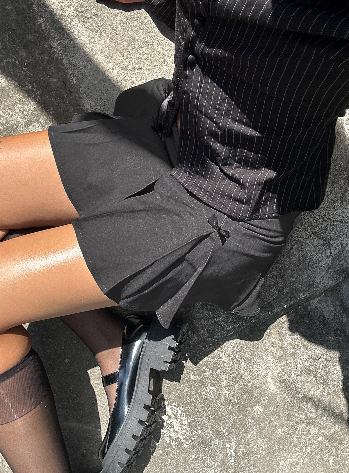   side view of model wearing Princess Polly Little Bow Peep Mini Skirt Grey Mini Skirts Skirts 