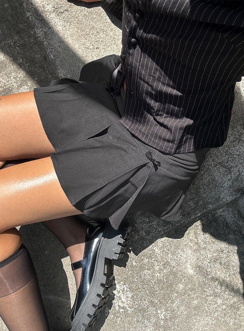   side view of model wearing Princess Polly Little Bow Peep Mini Skirt Grey Mini Skirts Skirts 