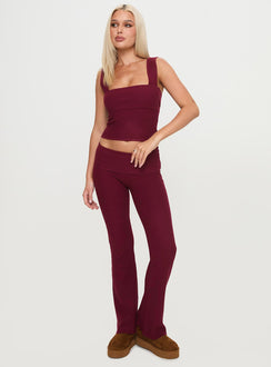 front view of model wearing Princess Polly Closed Eyes Flared Pants Maroon Low Rise Pants Pants 