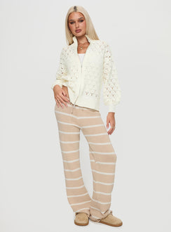 side view of model wearing Princess Polly Sirena Zip Through Knit Sweater Cream Jumpers 