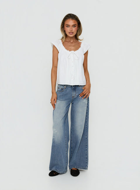 Featuring Johnni Floral Printed Low Rise Jeans Mid Wash womens-jeans with low-rise waist detail Princess Polly
