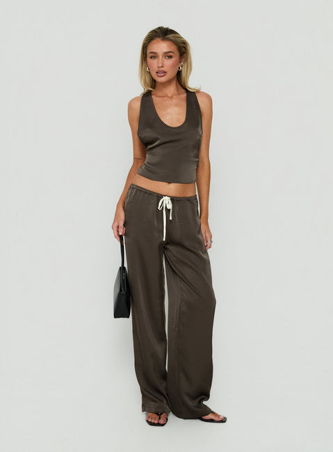 Showcasing the Dialled Up Tie Waist Satin Pants Mocha in womens regular pants with mid-rise detail front view of model wearing Princess Polly