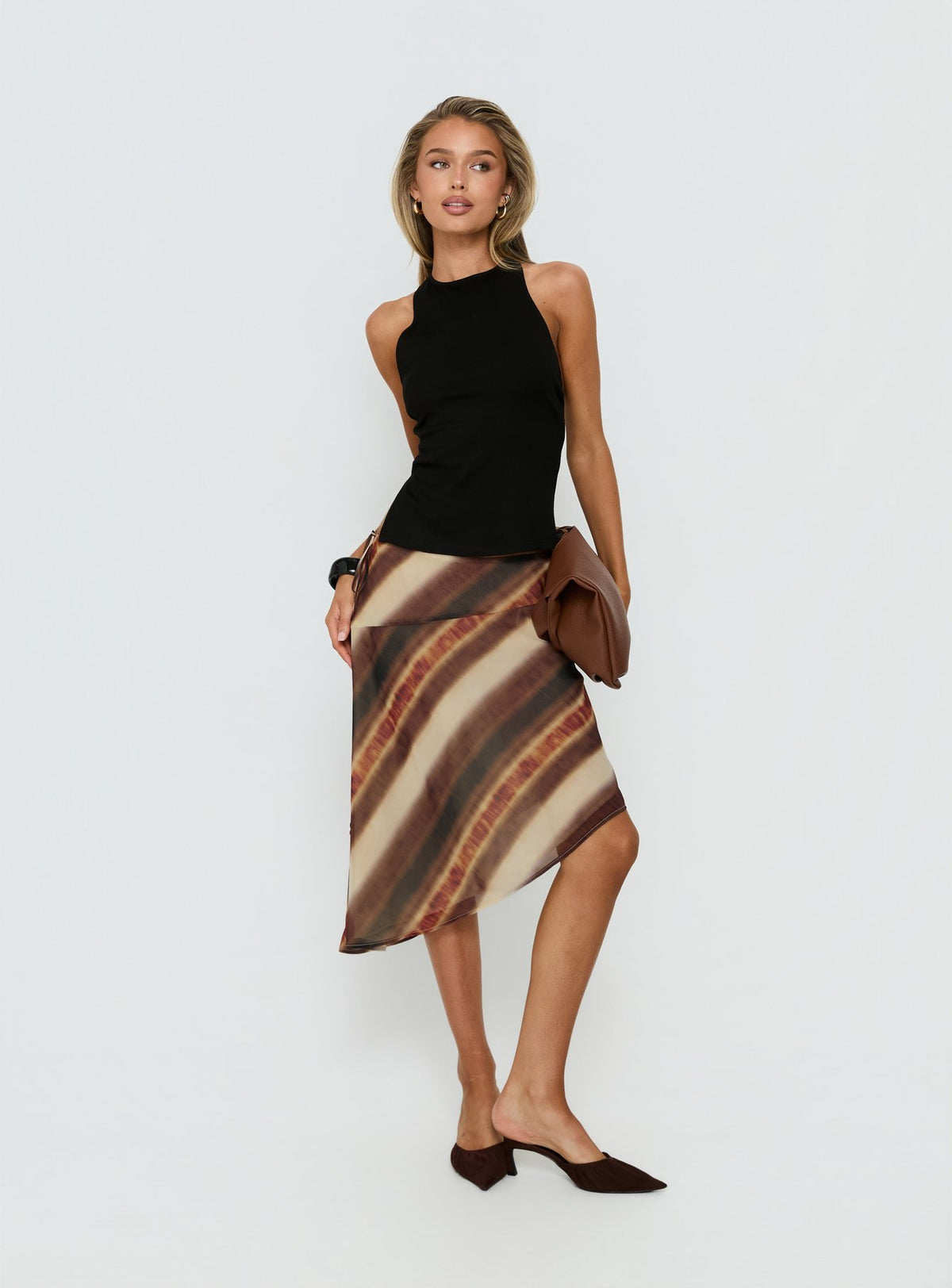 Shop the Esmira Asymmetrical Midi Skirt Brown Stripe Tall in womens-skirts with midi length side view of model wearing