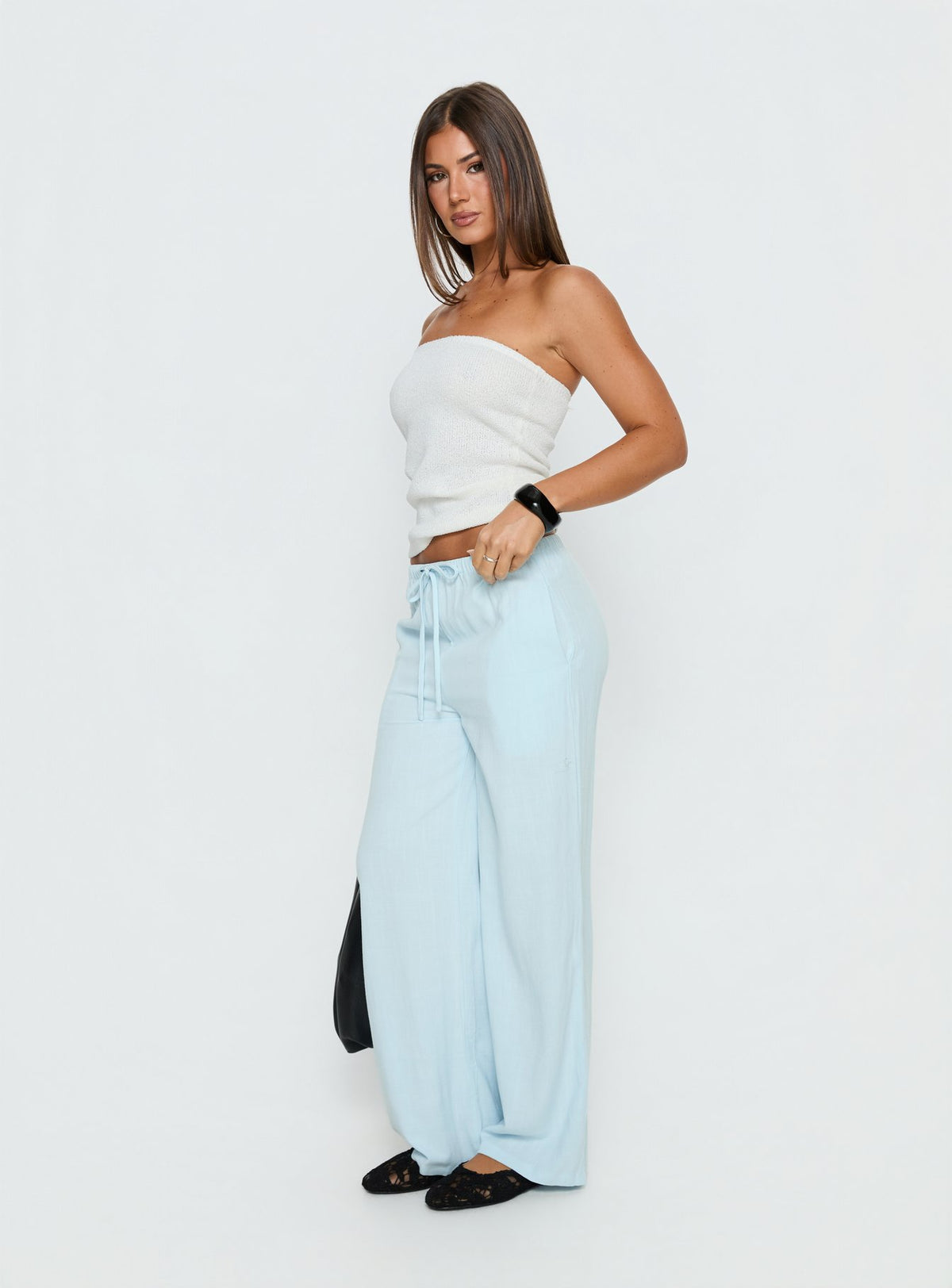 side view of model wearing Princess Polly Parklea Pants Icy Blue High Rise Pants Pants 