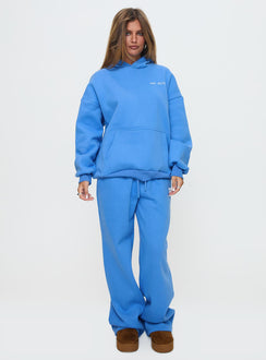 side view of model wearing Princess Polly Princess Polly Hooded Sweatshirt Bubble Text Blue / White Jumpers 