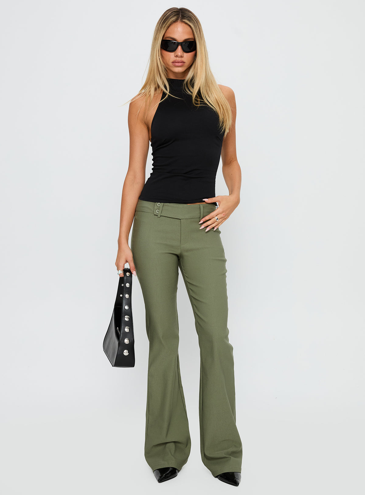 front view of model wearing Princess Polly Kinkirk Flared Pants Olive Green Low Rise Pants Pants 