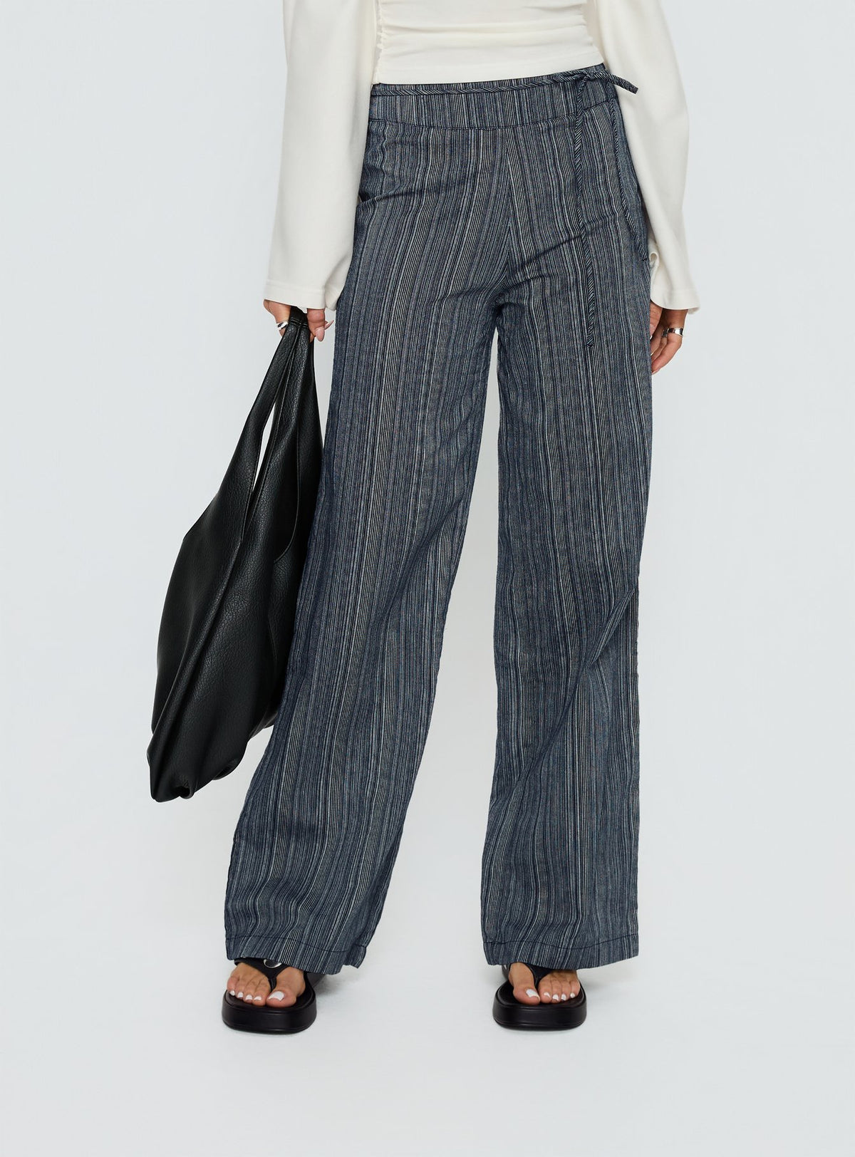 back view of model wearing Princess Polly Rush Hours Tie Up Pants Navy High Rise Pants Pants 