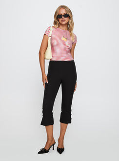 front view of model wearing Princess Polly Marcello Graphic Top Red Check Sleeveless Crew Neck 