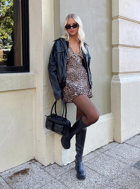 side view of model wearing Princess Polly Nellie Mini Dress Leopard Petite Plunger 