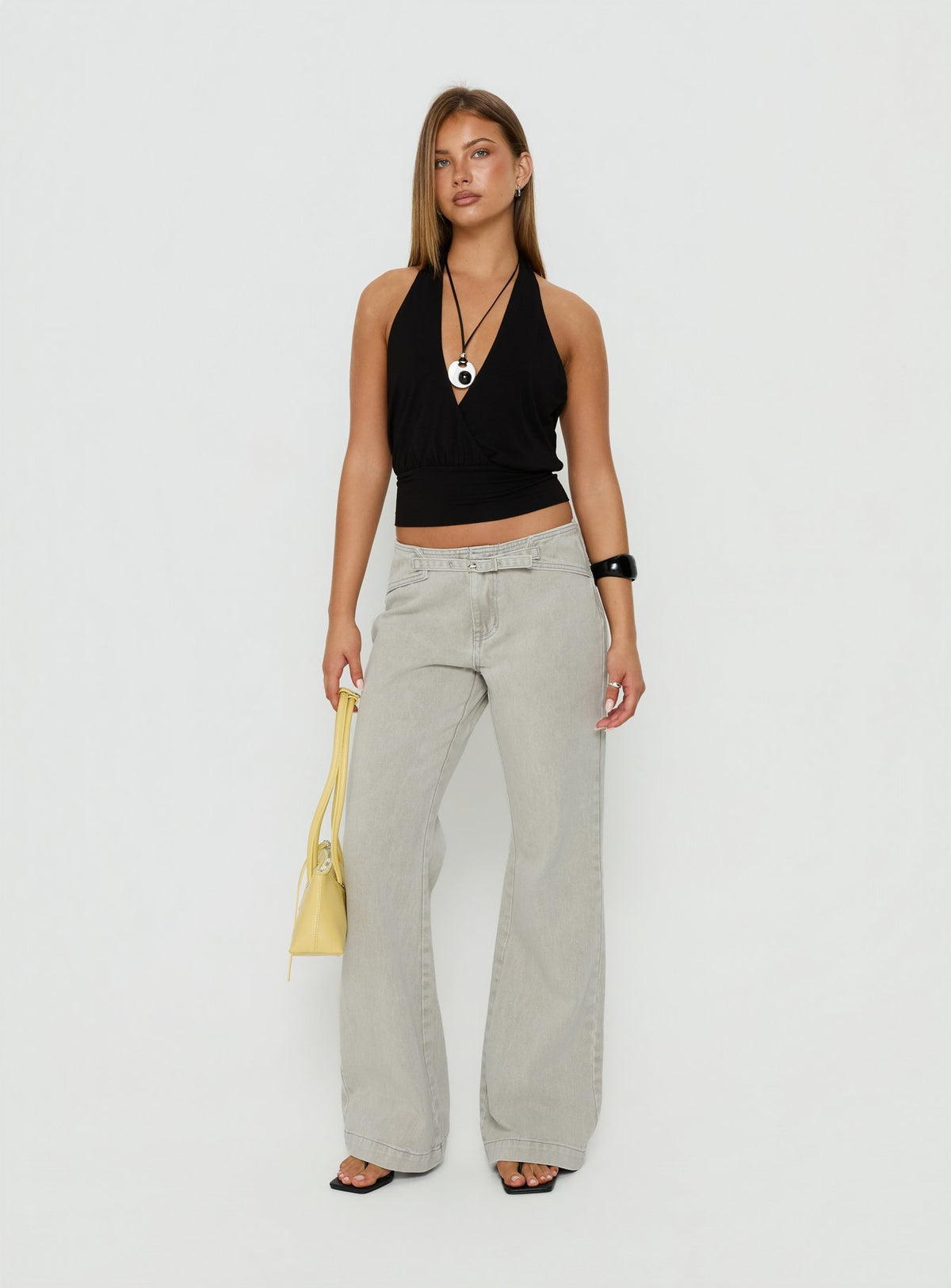 Introducing the Slow Ride Mid Rise Bootleg Belted Jeans Desert Grey in womens-jeans front view of model wearing Princess Polly