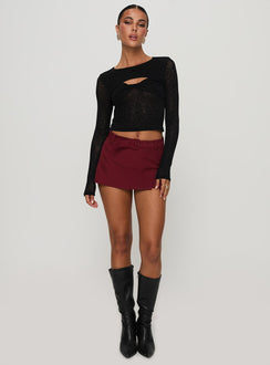 back view of model wearing Princess Polly Volley Mini Skort Cherry Red Tall High Waisted Shorts 
