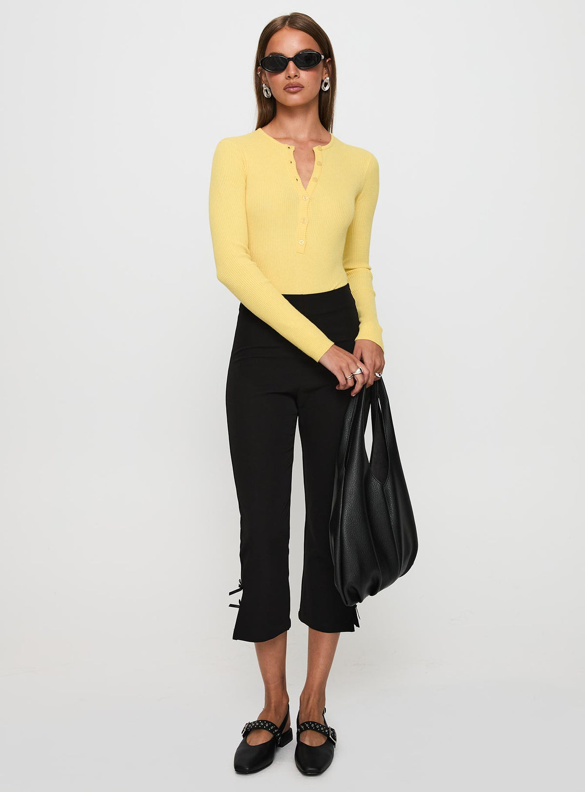 side view of model wearing Princess Polly Kerra Long Sleeve Bodysuit Lemon Long Sleeve Tops Bodysuit 
