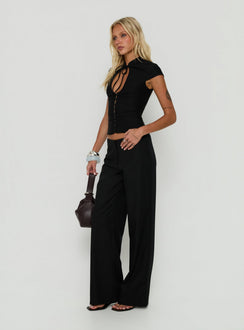 Displaying Agazia No Waist Low Rise Straight Pants Black in womens regular pants side view of model wearing