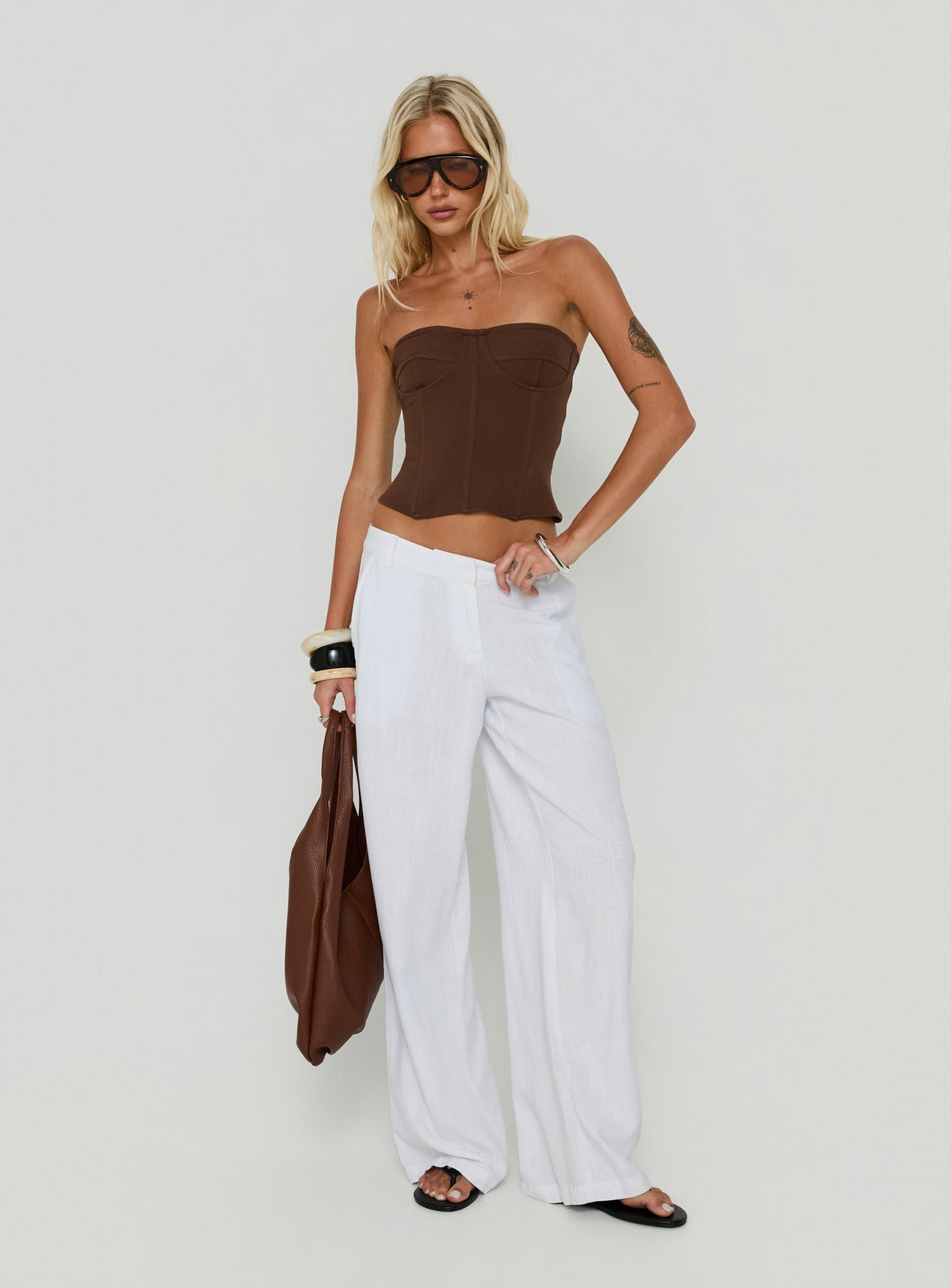 Designed with the Syrena Tailored Wide Leg Pant White in womens regular pants featuring high-rise side view of model wearing Princess Polly