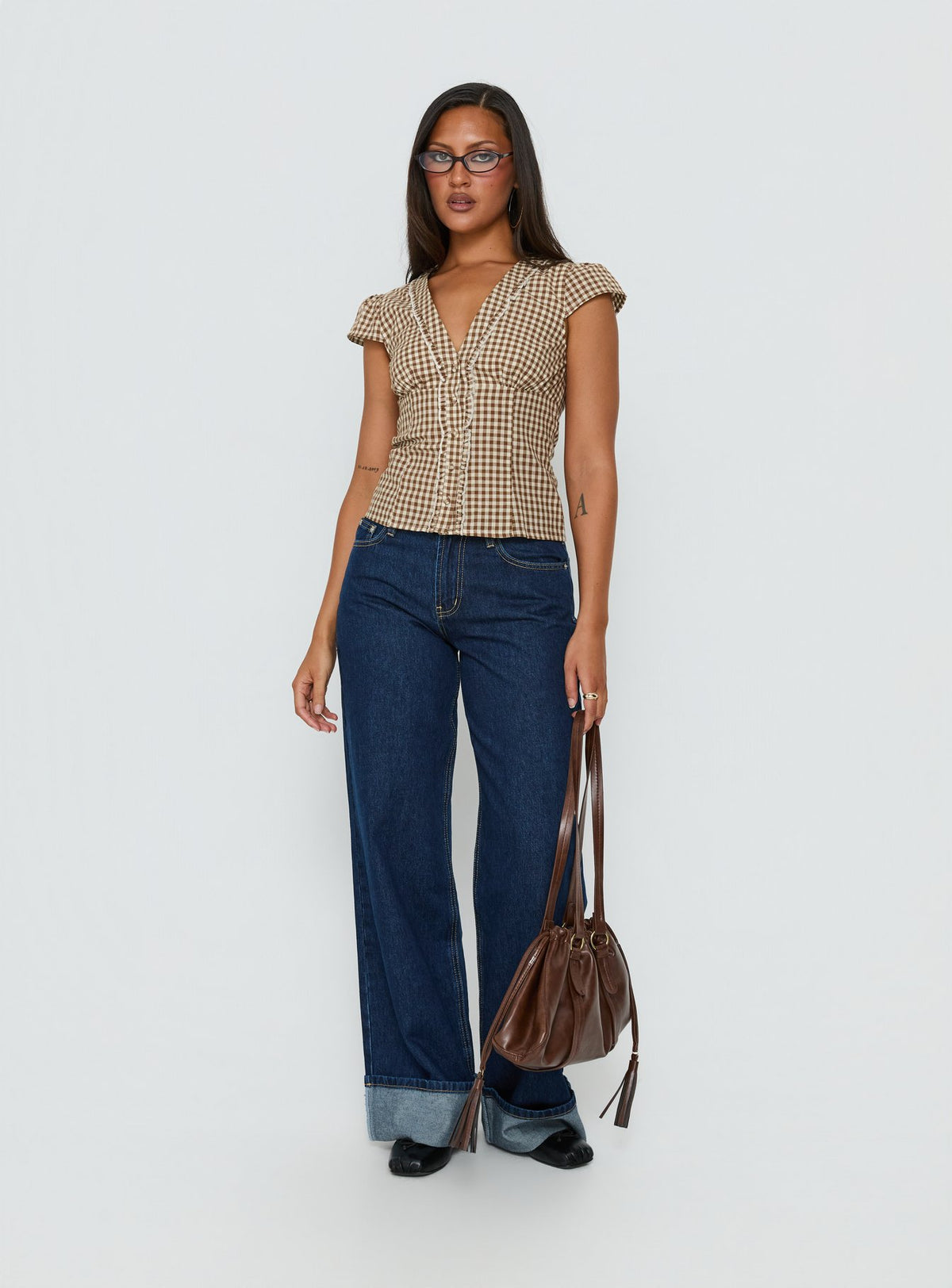 front view of model wearing Princess Polly Darla Low Rise Straight Leg Cuff Jean Dark Blue Wash Low Rise Jeans Jeans 