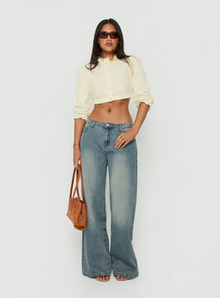 Discover the Karlos Low Rise Cinched Baggy Jeans Vintage Mid Blue Wash in womens-jeans featuring abstract print front view of model wearing Princess Polly