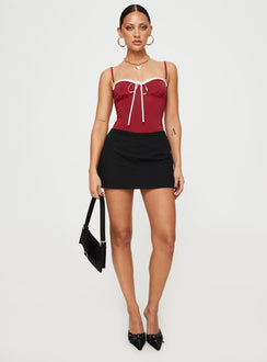 side view of model wearing Princess Polly Damsel Bodysuit Burgundy Sleeveless Bodysuit 