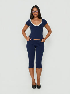 Experience the Rowanna Sporty Capri Pants Navy / Cream womens-regular-pants with high-rise front view of model wearing Princess Polly