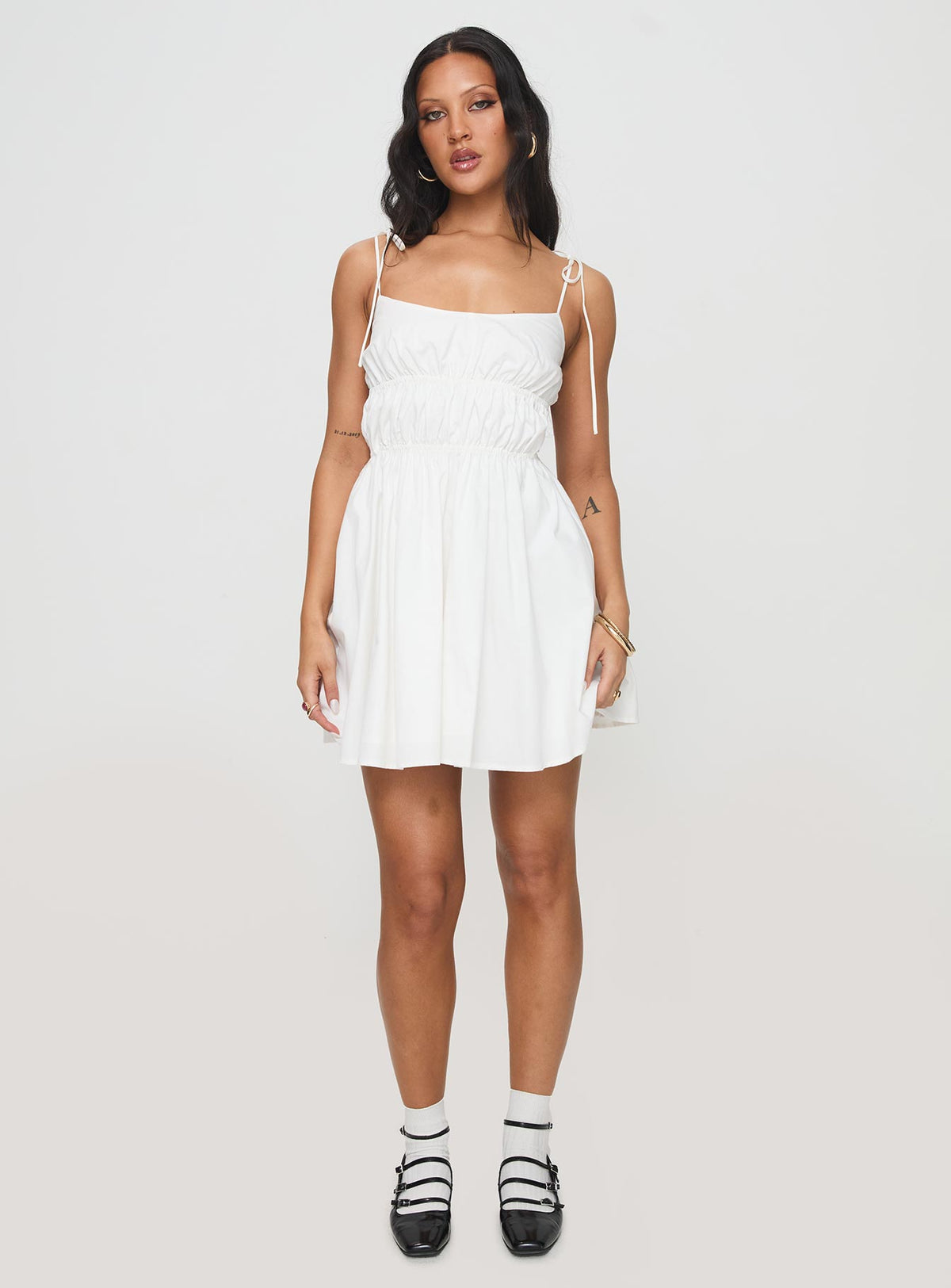 side view of model wearing Princess Polly Jacksonne Mini Dress White Scoop Neck 