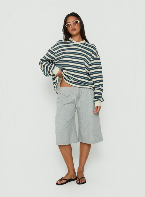 Showcasing the Opollo V Neck Jumper Blue Multi Stripe womens-jumpers with short length front view of model wearing Princess Polly
