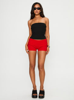 front view of model wearing Princess Polly Baseline Low Rise Rib Shorts Red Low Rise Shorts 