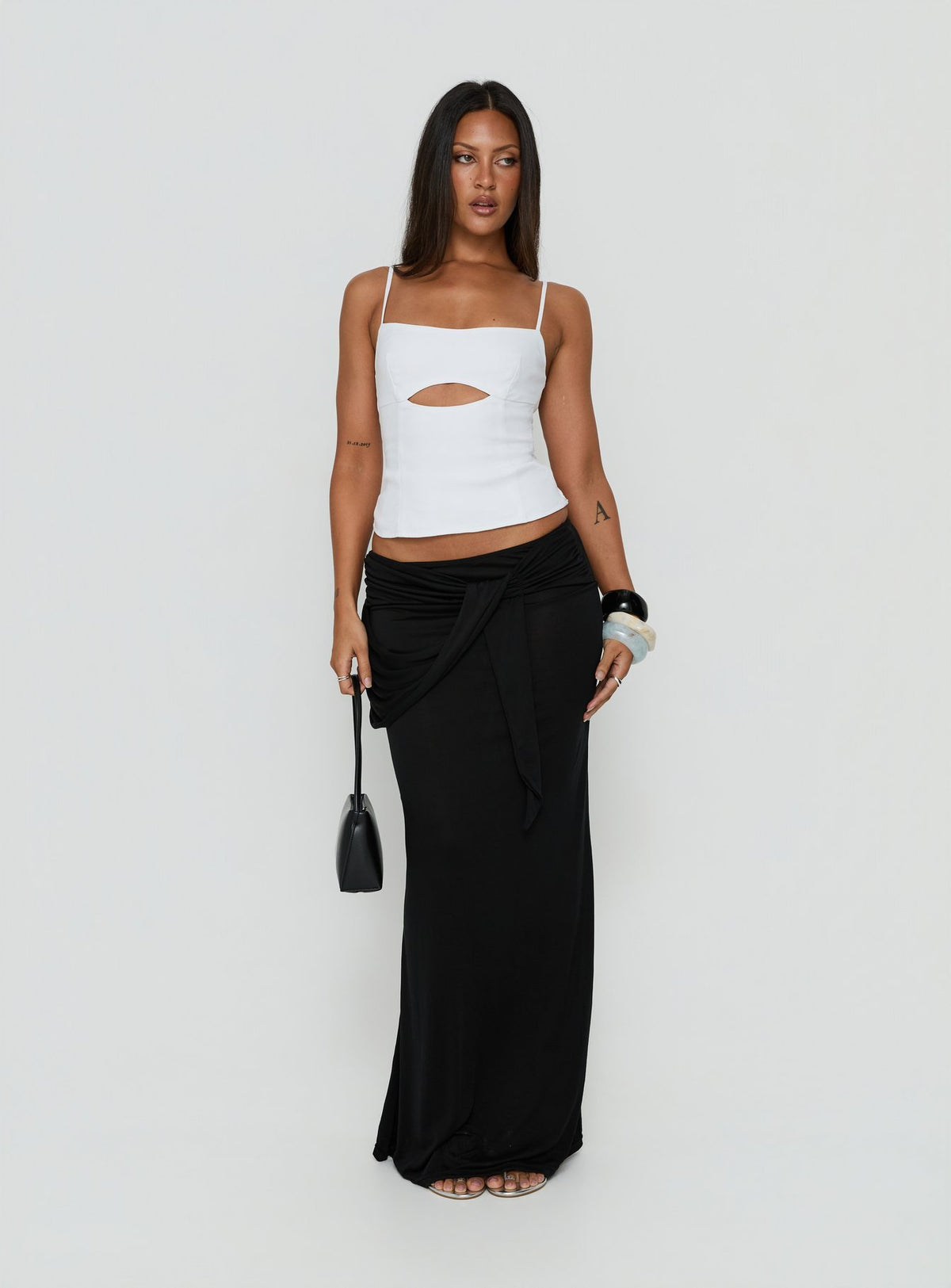 Showcasing the Samelia Wrap Maxi Skirt Black womens-skirts in maxi length front view of model wearing Princess Polly
