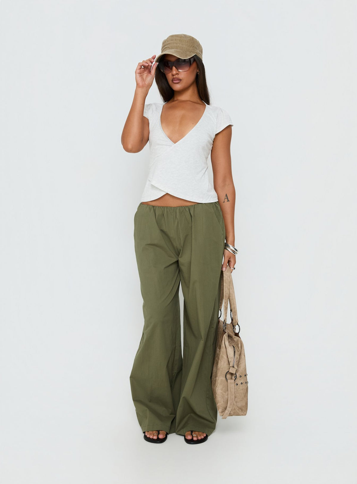 Featuring Lunea Concealed Waistband Pants Khaki Petite in mid-rise womens-regular-pants front view of model wearing Princess Polly