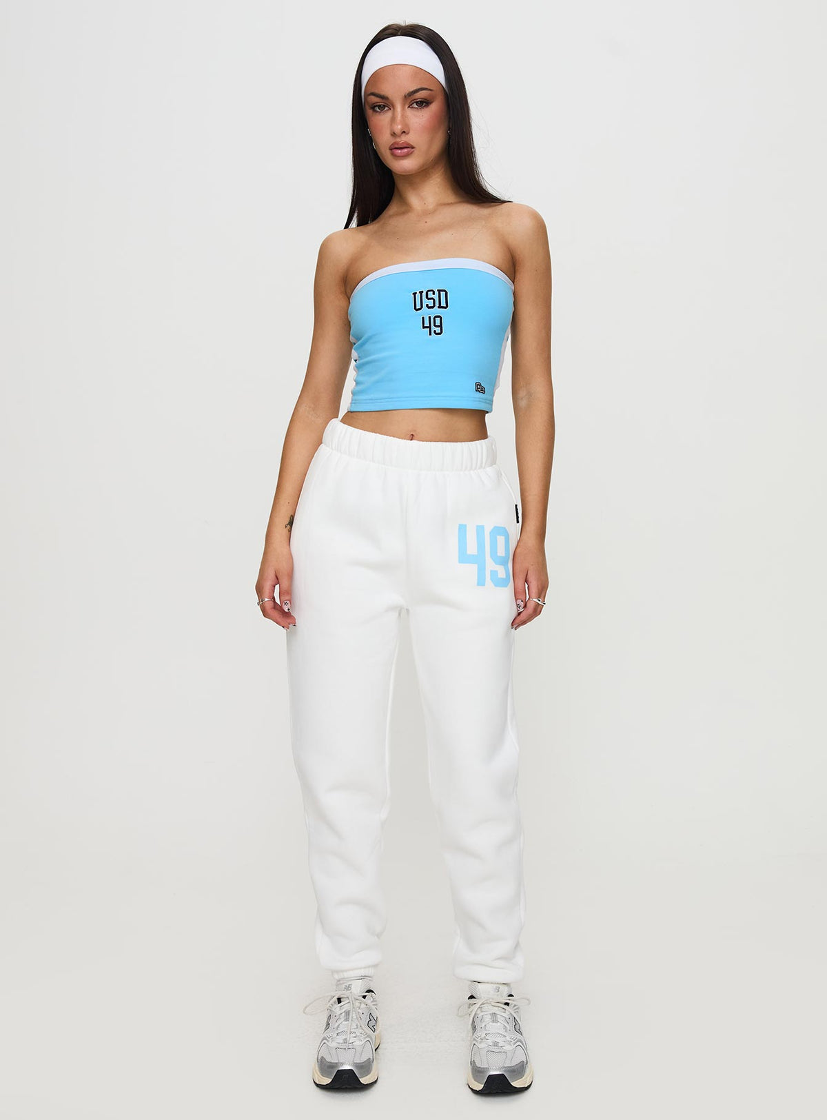 Crafted from USD Sweatpants White in womens-regular-pants with mid-rise waist, front view of model wearing Princess Polly