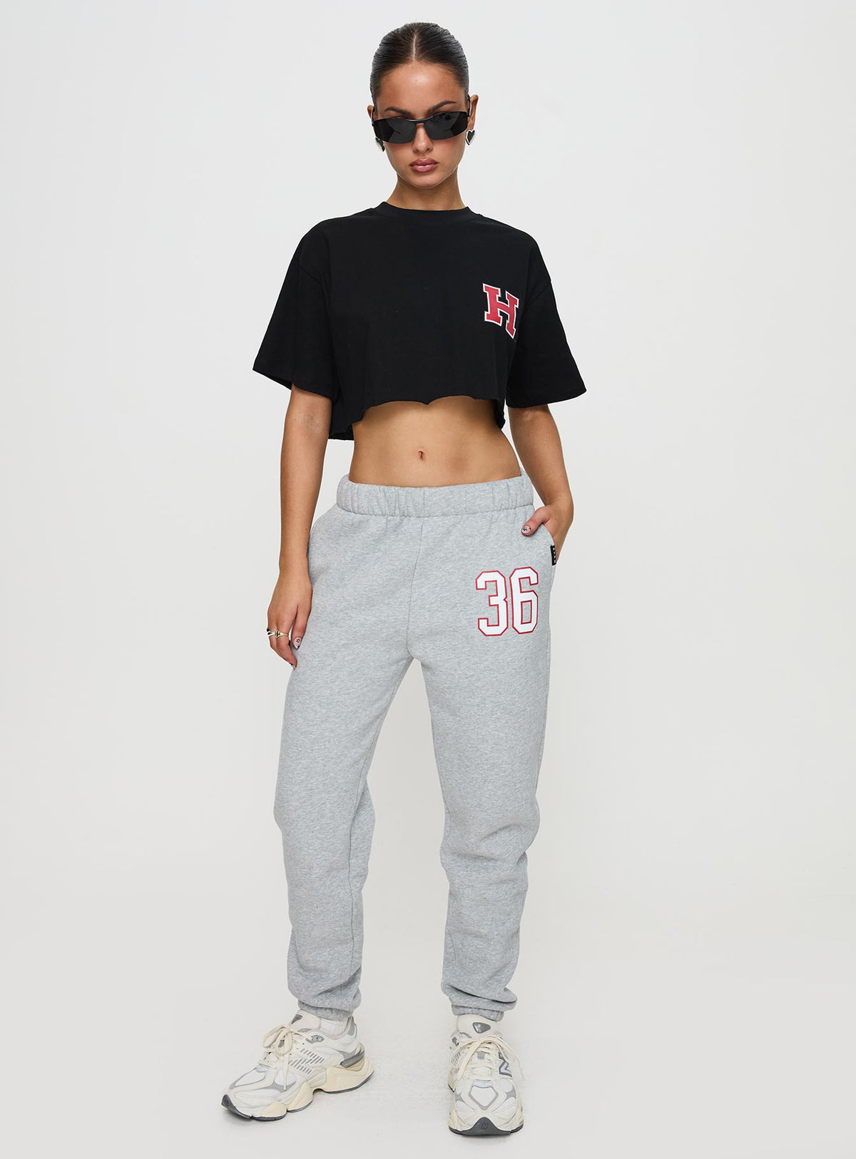 front view of model wearing Princess Polly Harvard Graphic Track Top Black Short Sleeves Crew Neck 