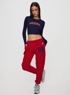 Designed with U of A Sweatpants Red in womens regular pants, mid-rise and graphic print, detail view of model wearing