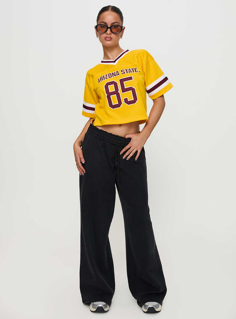 front view of model wearing Princess Polly ASU Football Jersey Gold Half Sleeves V-Neck 