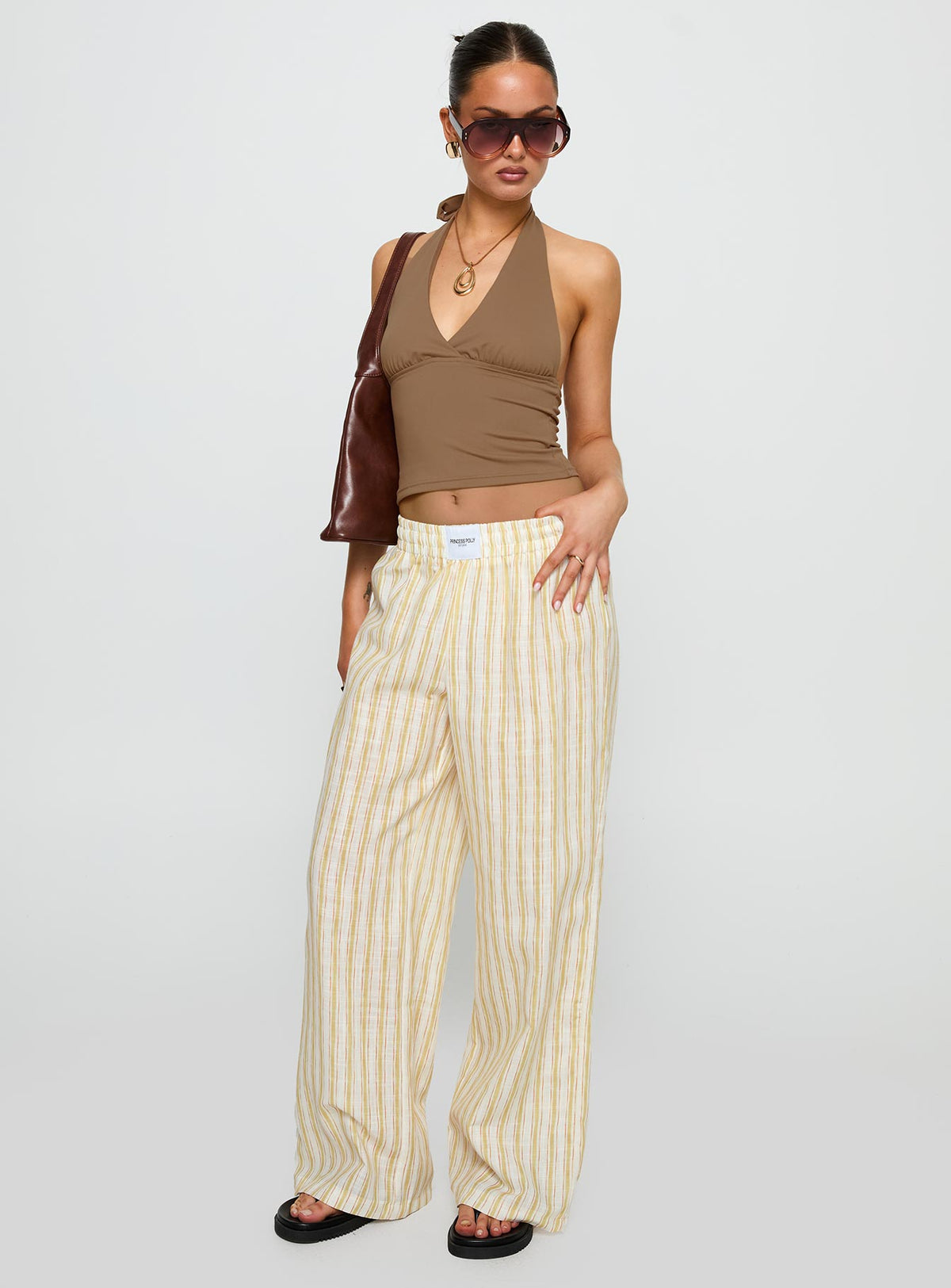 front view of model wearing Princess Polly Beach House Pants Yellow Stripe High Rise Pants Pants 