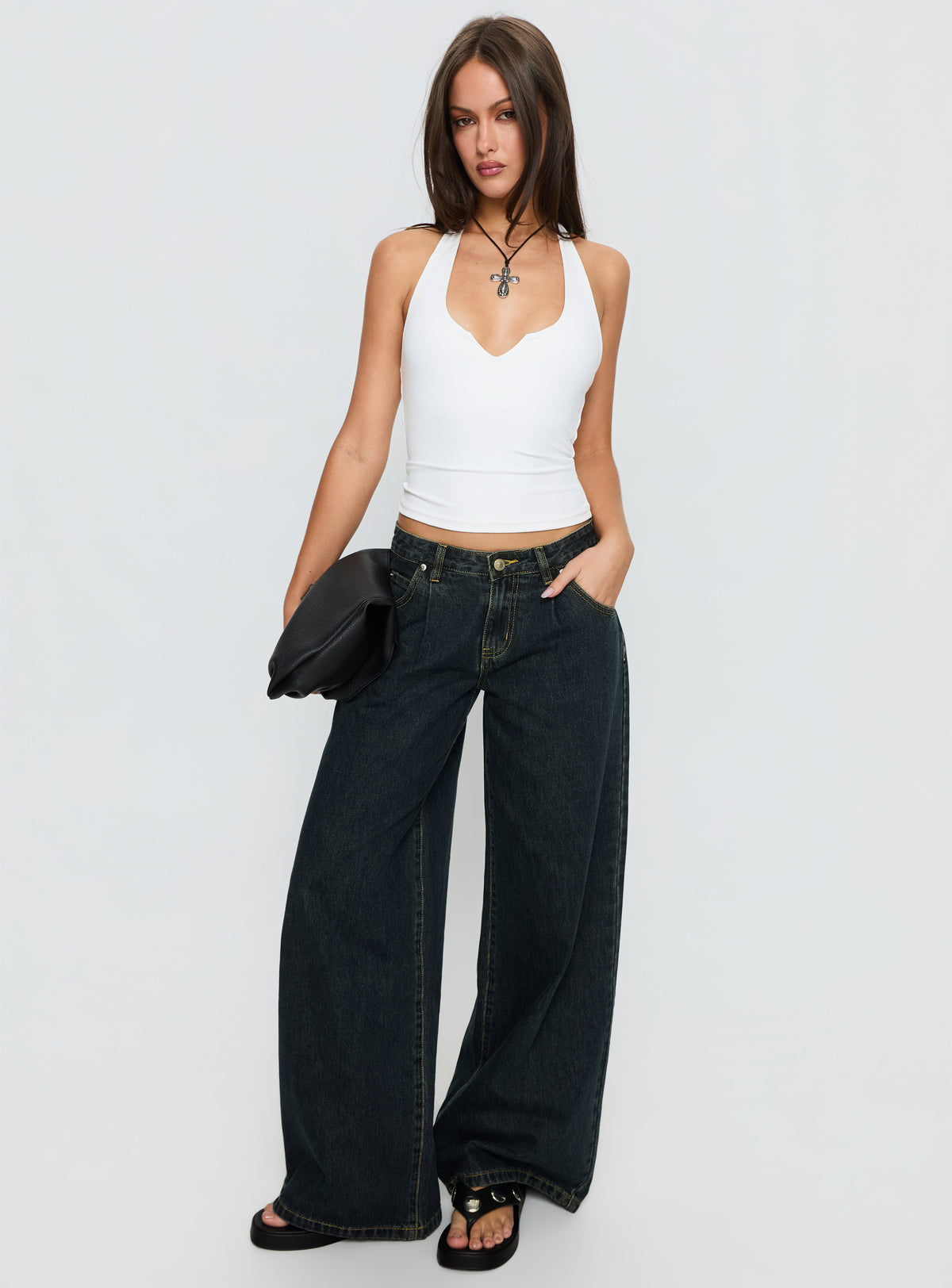back view of model wearing Princess Polly Supercut Low Rise Baggy Pleat Jeans Grunge Wash Low Rise Jeans 
