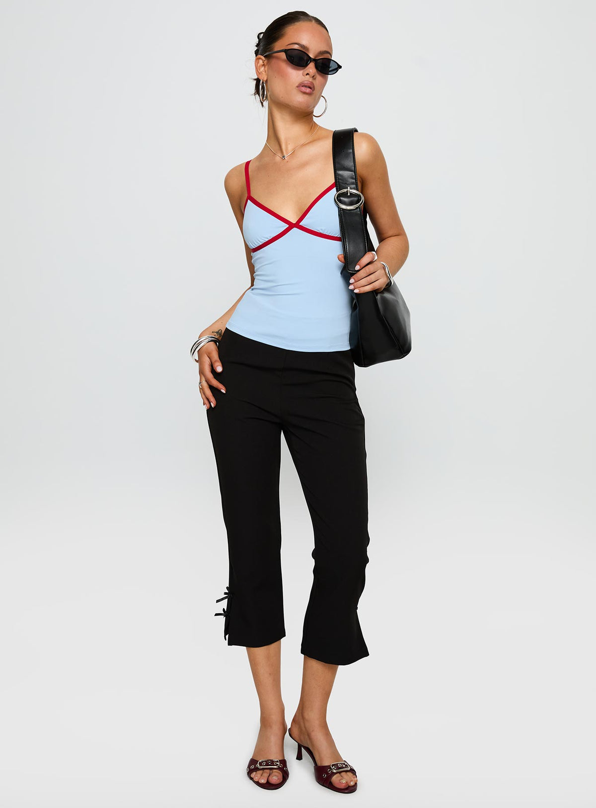 front view of model wearing Princess Polly Tiera Top Blue / Red Sleeveless V-Neck 