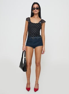 side view of model wearing Princess Polly Halston Briefs Blue Denim High Waisted Shorts 