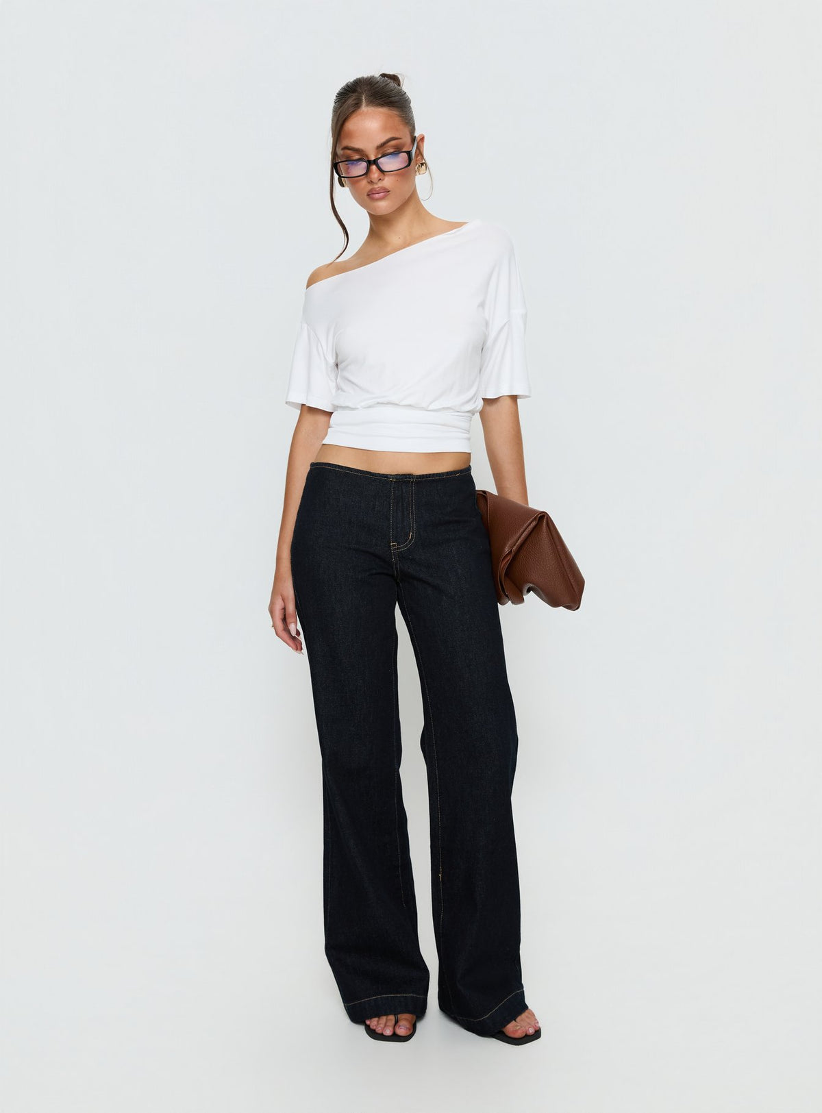 Showcasing Buenos No Waist Low Rise Straight Leg Jeans in Raw Denim womens-jeans with low-rise waist front view of model wearing