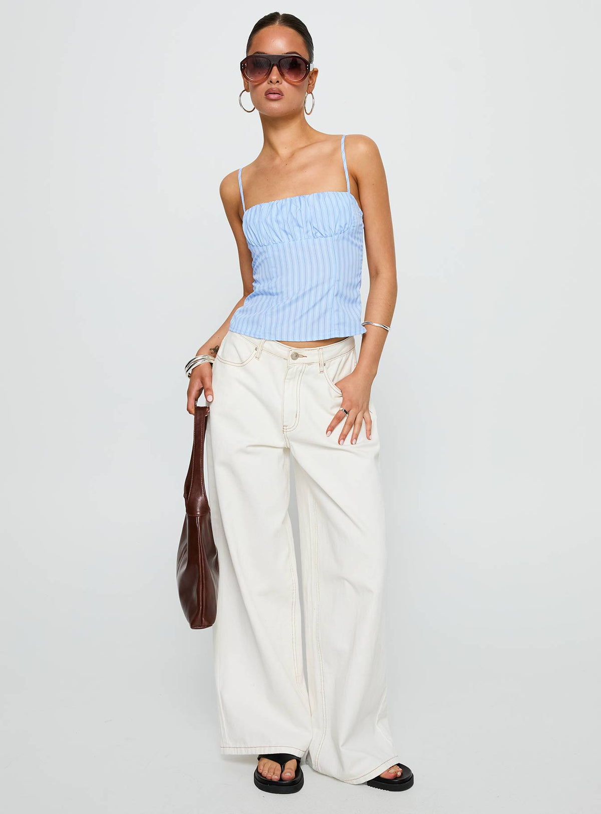 front view of model wearing Princess Polly Isolabella Top Blue Stripe Sleeveless Square Neck 