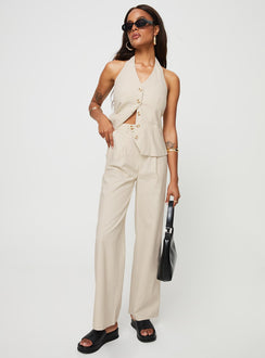 Matching linen set Halter neck top, fixed halter strap, button fastening at front, twin hip pockets High rise pants, belt looped waist, zip and button fastening, elasticated waistband at back, twin hip pockets, straight leg