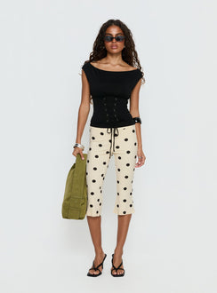 side view of model wearing Princess Polly Samaira Capri Pant Cream Polka Dot Mid Rise Pants Pants 
