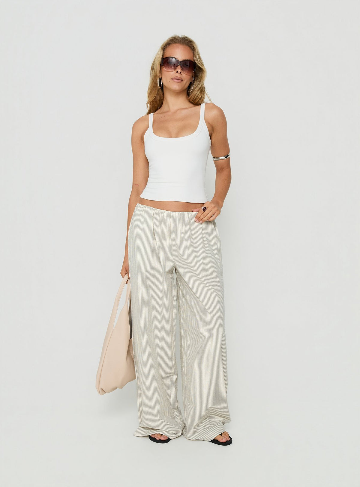 Featuring Lunea Concealed Waistband Pants Pinstripe womens regular pants with mid-rise detail view of model wearing Princess Polly