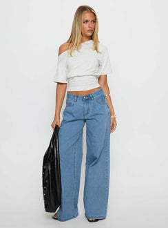 front view of model wearing Princess Polly Supercut Low Rise Baggy Pleat Jeans Light Blue Wash Low Rise Jeans Jeans 