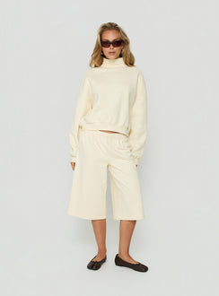 Showcasing the Anyya Funnel Neck Crew Jumper Cream in a short womens jumper front view of model wearing Princess Polly