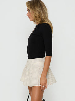 Designed with the Fairylike Mini Skirt Multi Stripe womens-skirts in mini length side view of model wearing