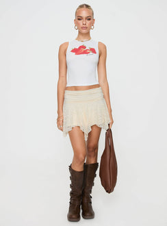   side view of model wearing Princess Polly Lifas Lace Mini Skirt Cream Petite Mini Skirts Skirts 