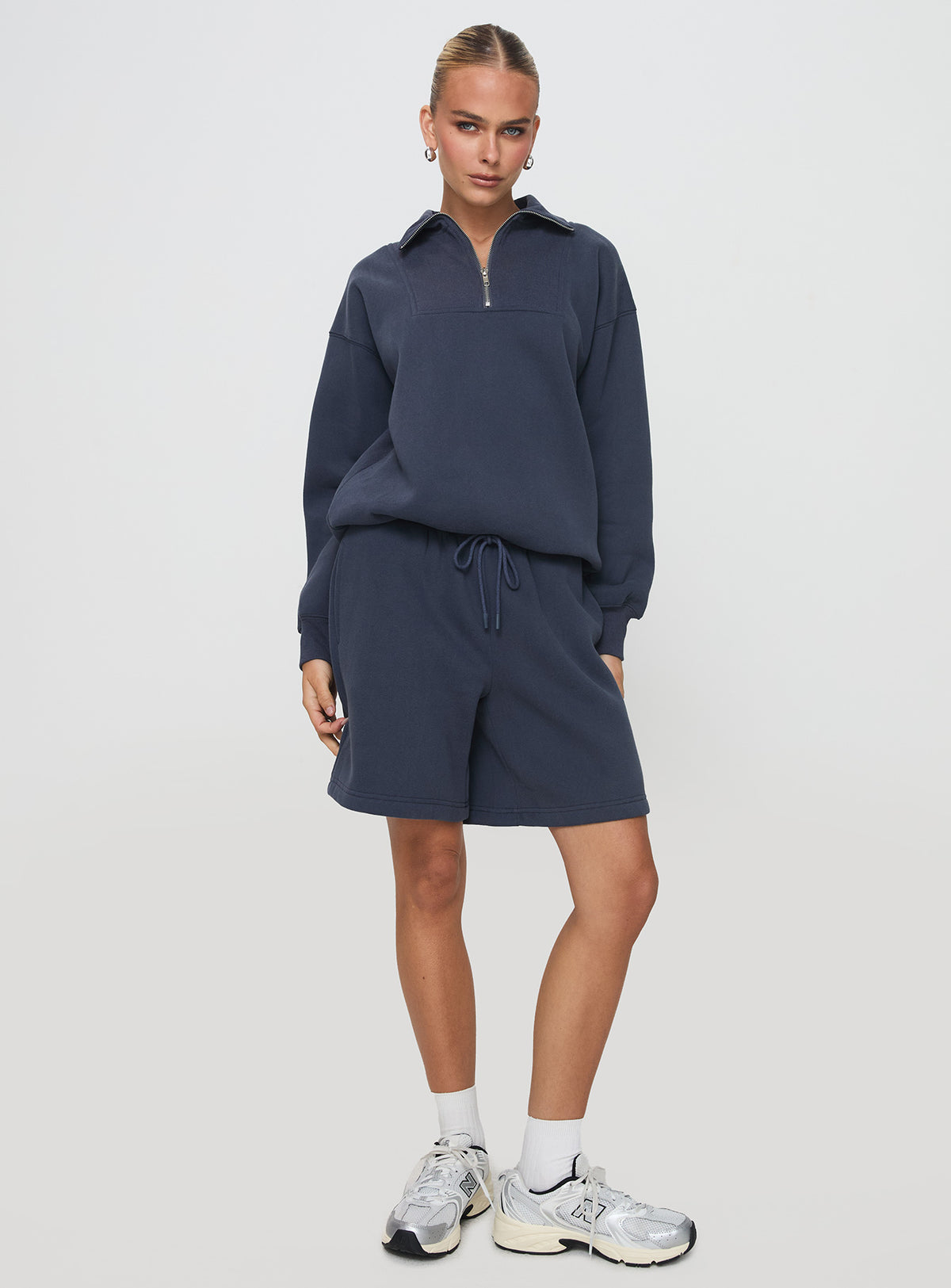 front view of model wearing Princess Polly Dream Fleece Quarter Zip Sweatshirt Navy Jumpers 