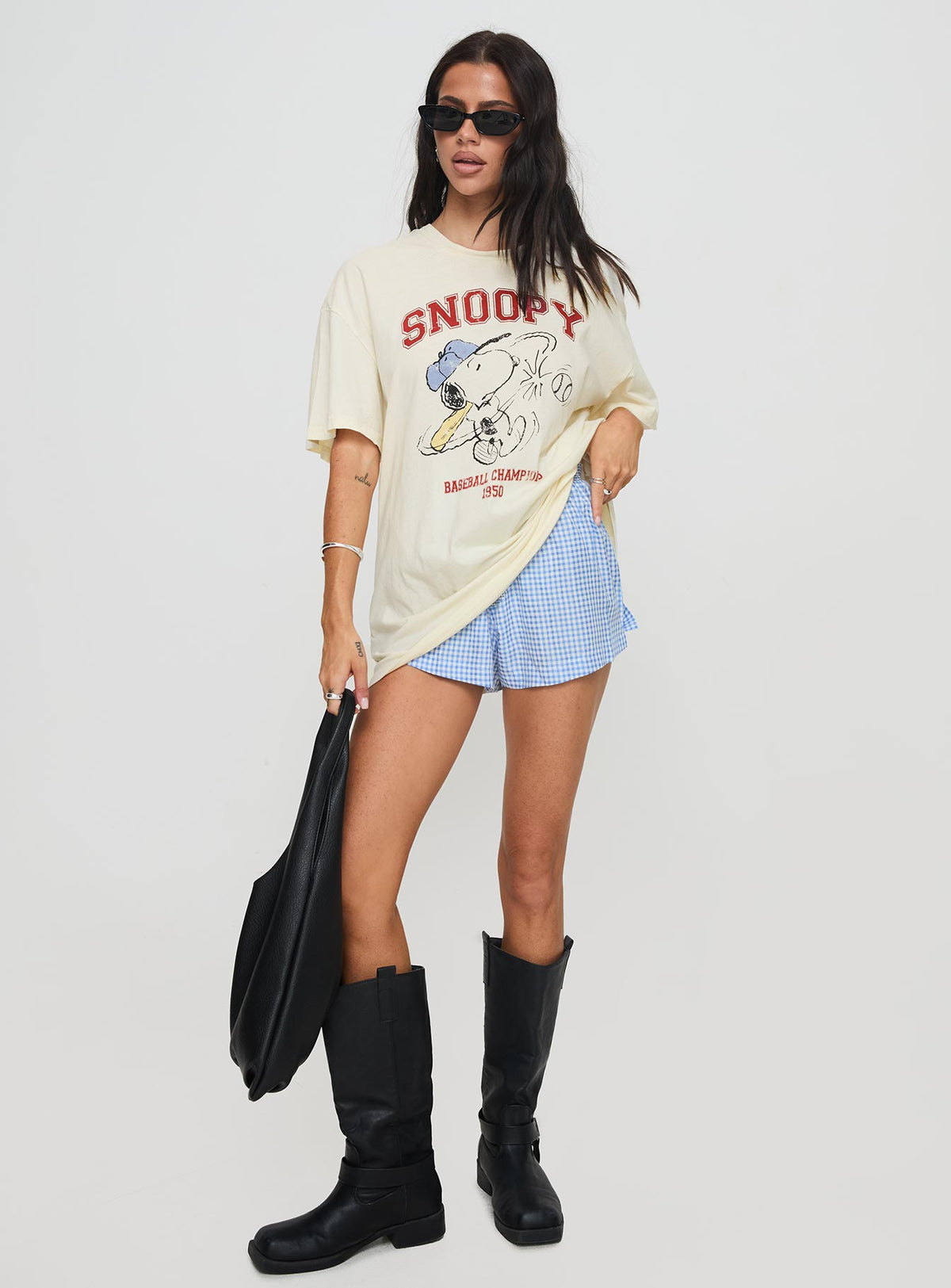 side view of model wearing Princess Polly Snoopy Championship Oversized Tee White Half Sleeves Crew Neck 