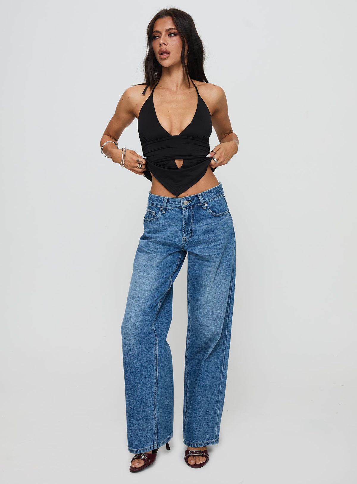 front view of model wearing Princess Polly Serenitia Mid Rise Relaxed Jeans Mid Blue Wash Tall Mid Rise 